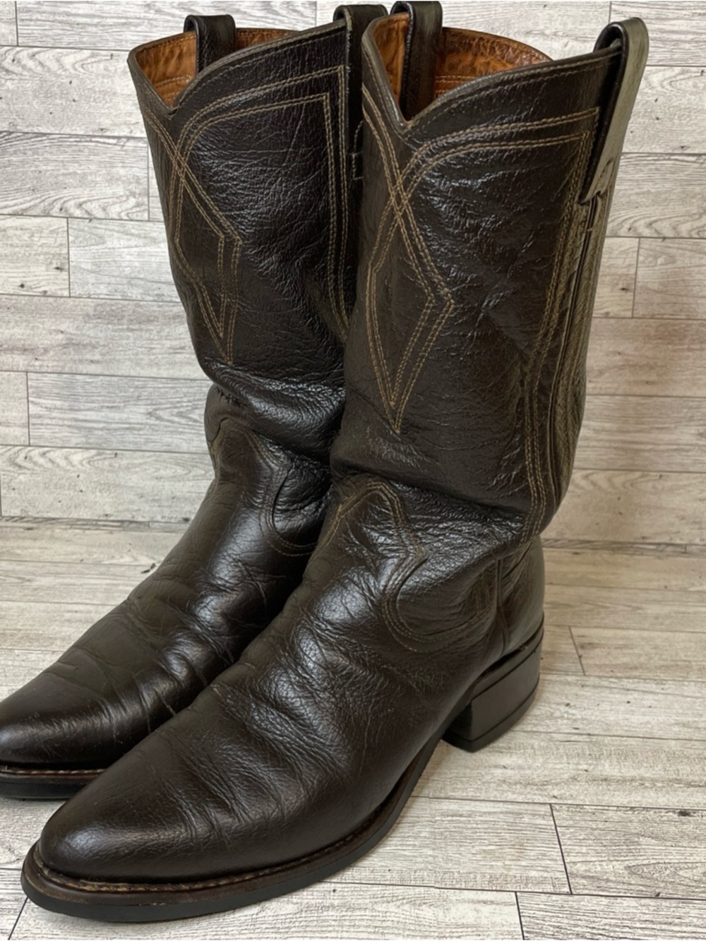 These are vintage Texas Brand black water buffalo leather cowboy boots.